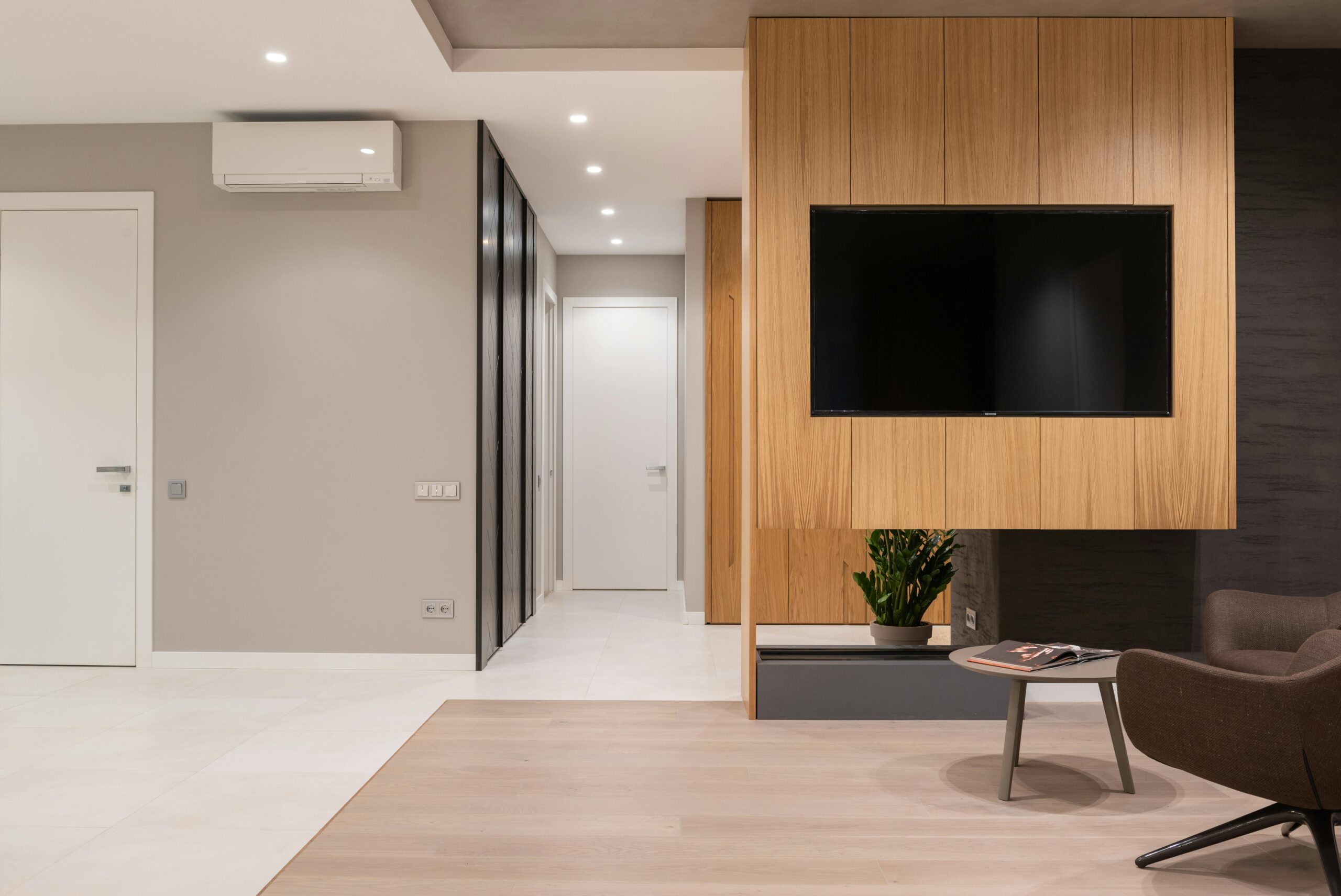 Photo by Max Vakhtbovycn: https://www.pexels.com/photo/living-room-with-armchair-and-table-near-tv-6758777/