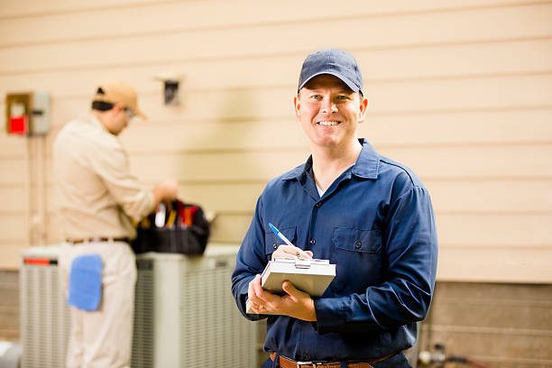 https://www.istockphoto.com/photo/air-conditioner-repairmen-work-on-home-unit-blue-collar-workers-gm522578757-51459420?utm_source=pexels&utm_medium=affiliate&utm_campaign=sponsored_photo&utm_content=srp_inline_media&utm_term=air%20conditioner%20technician
